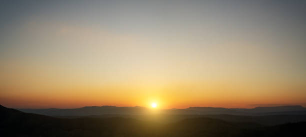 istock Panoramic beautiful sunset landscape from the forest in the national park. 2033782478