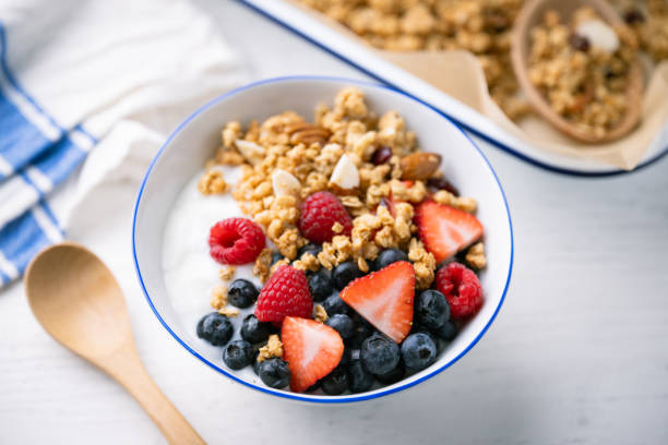 istock homemade granola with berries and yogurt 2033868408