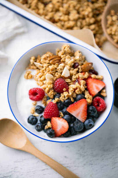 istock homemade granola with berries and yogurt 2033869446