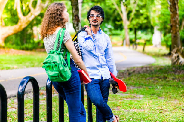 istock Diverse happy young university students hanging out outdoors on campus 2033879200