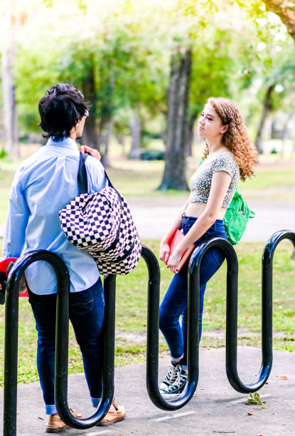 istock Diverse happy young university students hanging out outdoors on campus 2033911939