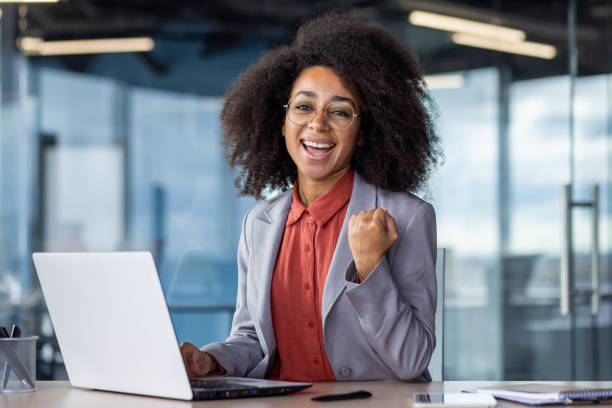 istock Successful young businesswoman celebrating a victory at work in office setting 2033918146