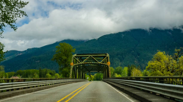 istock Old iron bridge in the background of mountains, Washington state 2033949552