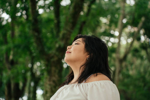 istock Asian woman contemplating nature 2034008117