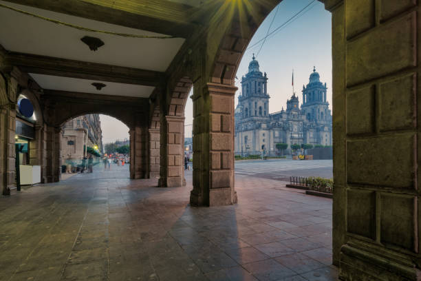 Colonnade on Zocalo square with the Metropolitan Cathedral in downtown Mexico City, Mexico at night.