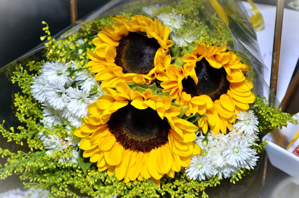 istock Beautiful bouquet with sunflower with white aster flowers 2034042456