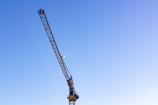 istock Tower crane at night with a lantern on against the sky. 2034052469