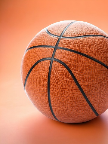 Basketball ball on white surface
