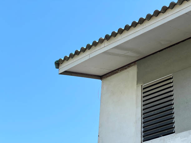 istock house with a chimney on the roof. 2034109059