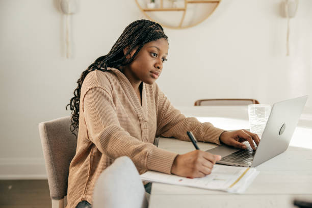 istock Screen Time to Study Time: Teen Transforms Laptop Use into Homework Mastery 2034159654