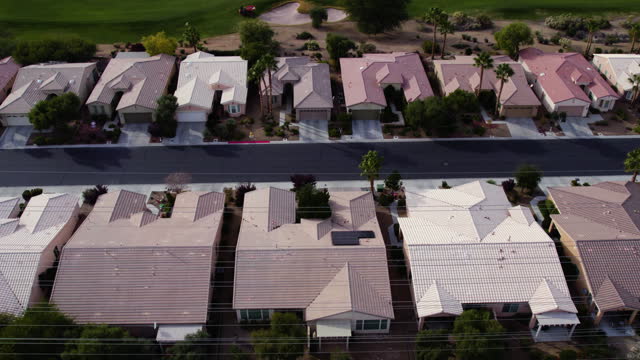 Aerial View of Idyllic American Residential Community, Lined Homes and Street on Sunny Day