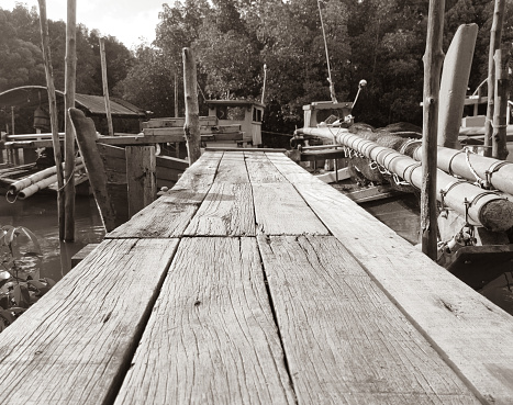 Black and white the atmosphere of the fishermen's jetty area to go down to the sea and where to park their boats and equipment