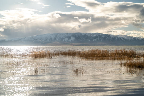 istock Cloudy Winter Day in Utah Lake Outside Sun Poking Through Blue Hour 2034371616