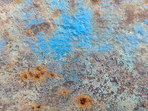 Rusty metal texture with abstract grunge patterns, suitable for background or overlay.