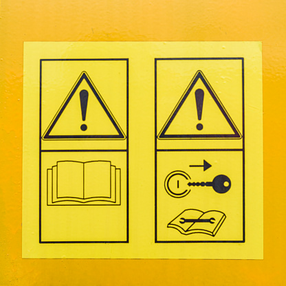 Yellow heavy machinery warning sticker