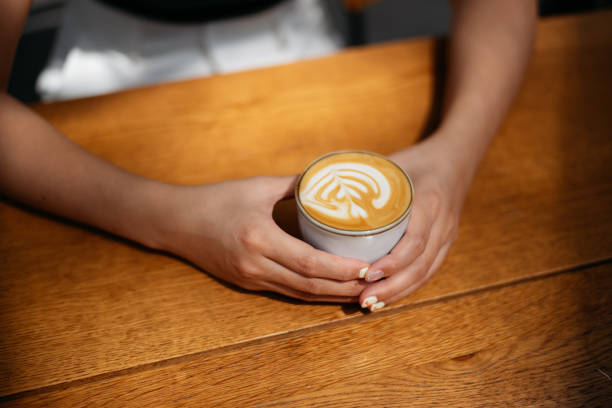 istock Asian woman enjoy coffee in a cafe 2034438425