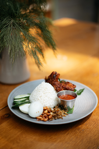 Nasi lemak is a Malay fragrant rice dish cooked in coconut milk and pandan leaf. A common dish in Malaysia and considered to be the national dish.