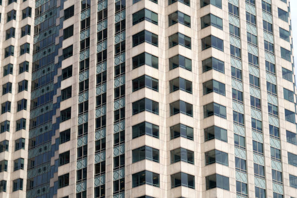 istock close up on facade view of glass windows in office building 2034447210
