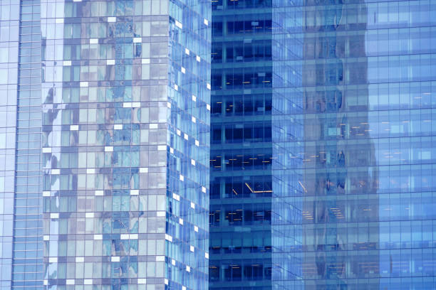 close up on modern office building with blue glass windows