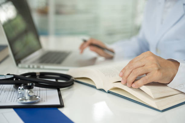 istock medical writer or medical communicator are studying clinical trial documents that describe research results, product use, and other medical information. 2034483089