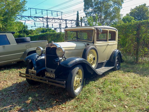 Remedios de Escalada, Argentina - Feb 11, 2024: An old 1931 Ford Model A Tudor two door sedan on the lawn at a classic car show in a park