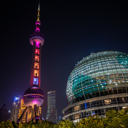 Oriental Pearl TV Tower lit up at night in Shanghai, China.