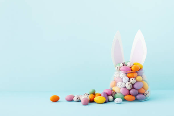 istock Colorful Easter candy jar decorated with bunny ears. 2034685274