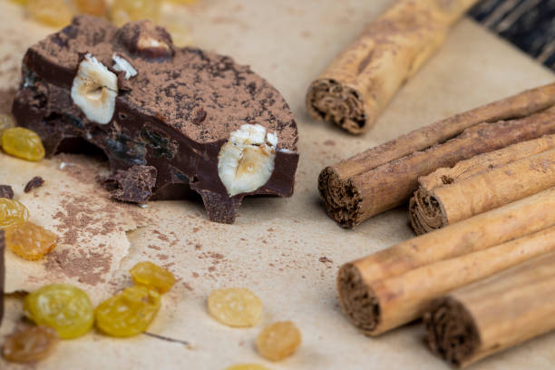 sweet chocolate with cocoa and nuts and other ingredients, homemade high-calorie chocolate with cocoa and sugar