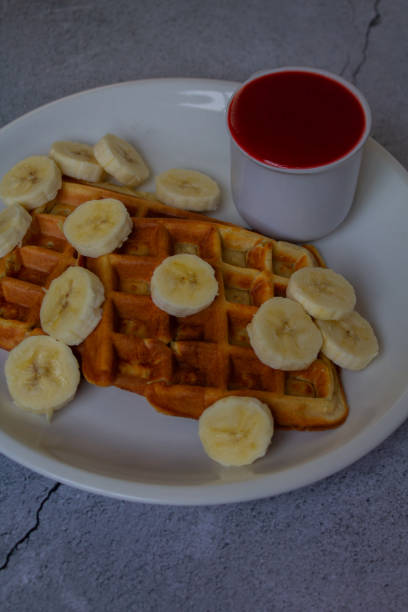 istock Homemade waffles with fruit coulis 2034728611