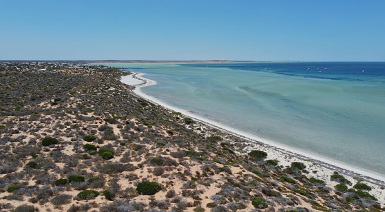 Drone photo of Denham in Western Australia and the surrounding area, which is the westernmost publicly accessible town in Australia. It is located in the Shark Bay (Malgana: Gathaagudu) World Heritage Site in the Gascoyne region