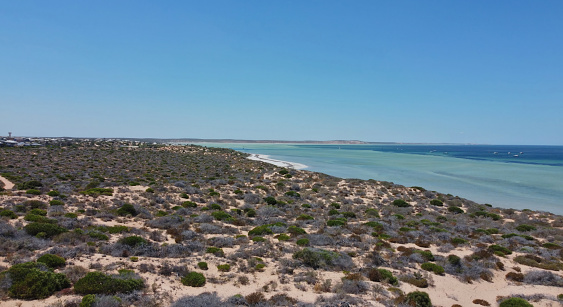 Drone photo of Denham in Western Australia and the surrounding area, which is the westernmost publicly accessible town in Australia. It is located in the Shark Bay (Malgana: Gathaagudu) World Heritage Site in the Gascoyne region