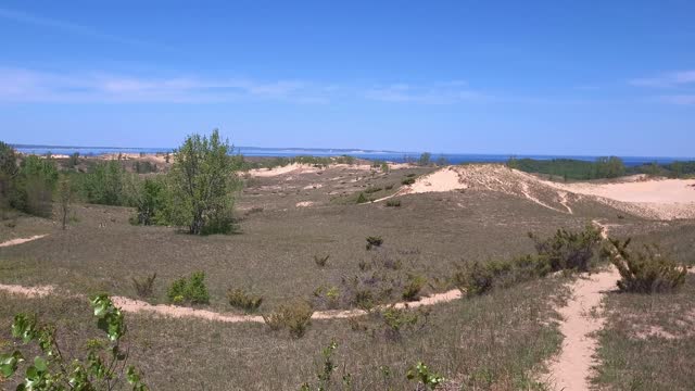 Popular Sleeping Bear Dune near one of the Great Lakes on sunny day