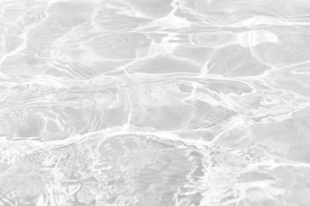 istock White water surface texture with ripples, splashes, and bubbles. Abstract summer banner background Water waves in sunlight with copy space cosmetic moisturizer micellar toner emulsion. White water. 2034747149