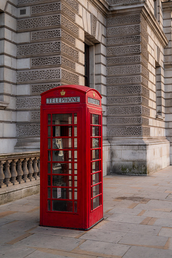 Closeup of Traditional red british telephone box in London, UK. Travelling concept. London landmarks. High quality photo