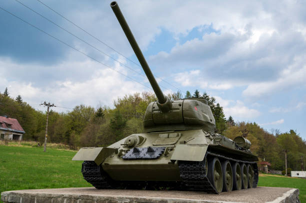 istock Soviet t-34 tank in a meadow on a concrete base. 2034770716