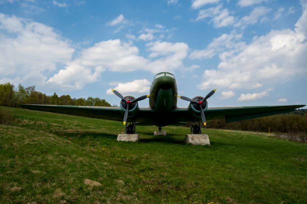 Soviet military aircraft Lisunov Li-2 on a meadow in the forest.