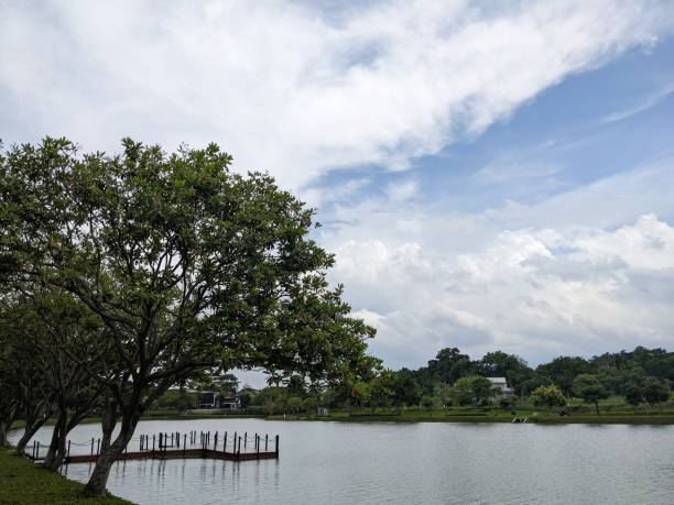 istock Mini jogging park on the Semarang Central Java with lake, cloudy vibes and blue sky. 2034772365