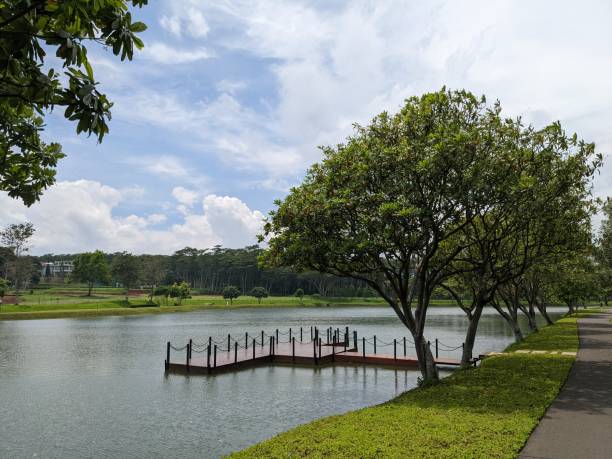 istock Mini jogging park on the Semarang Central Java with lake, cloudy vibes and blue sky. 2034775597