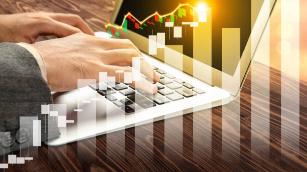 istock Business hand typing on a laptop with a virtual chart with increasing graph arrow 2034791069