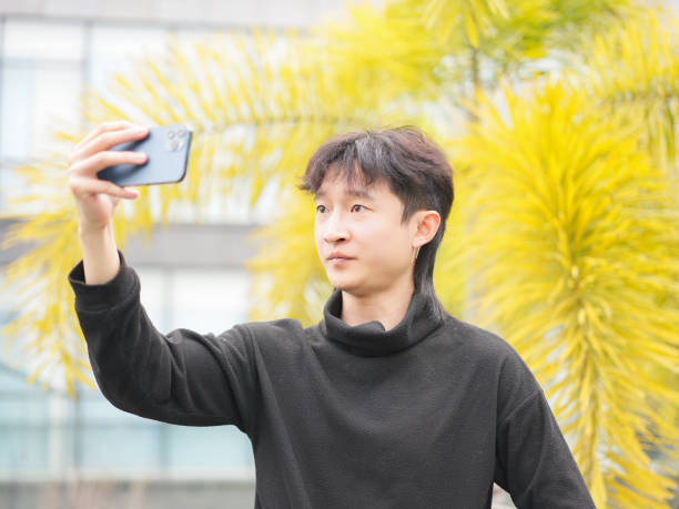 istock Man taking selfie with smartphone 2034799081