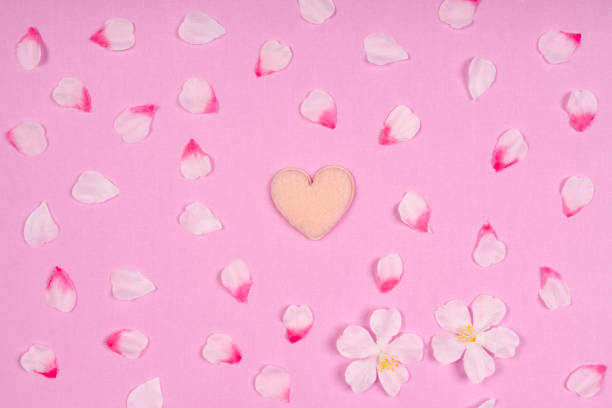 istock Heart-shaped emblem on pink fabric 2034806091