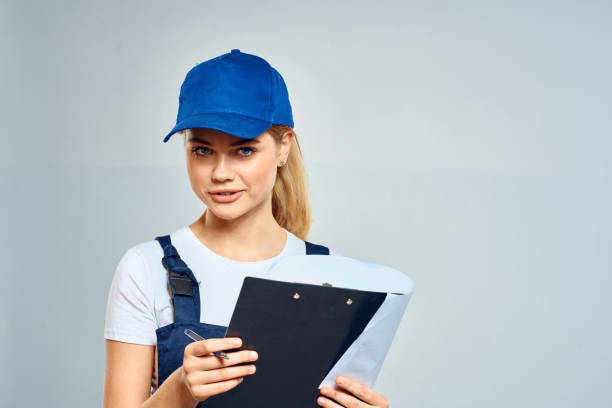 istock Woman courier in uniform documents service delivery 2034814216