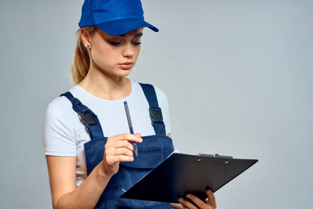istock Woman courier in uniform documents service delivery 2034823646