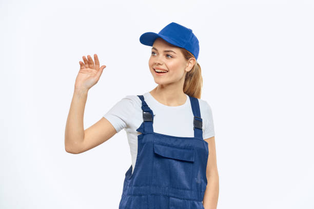 istock Woman in working uniform blue cap delivery courier delivery service 2034823871