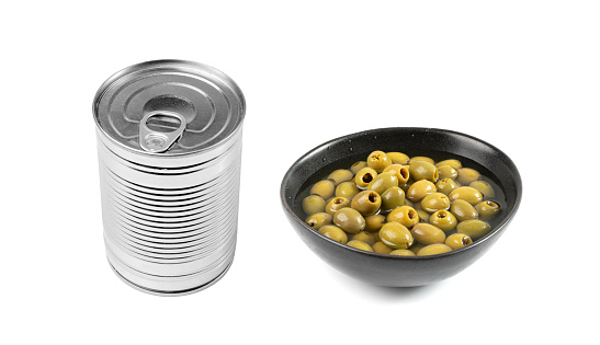 Green Pickled Olives in Black Bowl. Pitted Fermented Olives, Marinated Mediterranean Snack, Olive Pickles on White Background