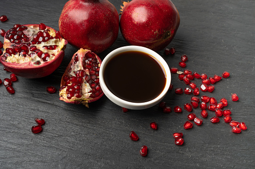 Fresh  pomegranate juice on dark background