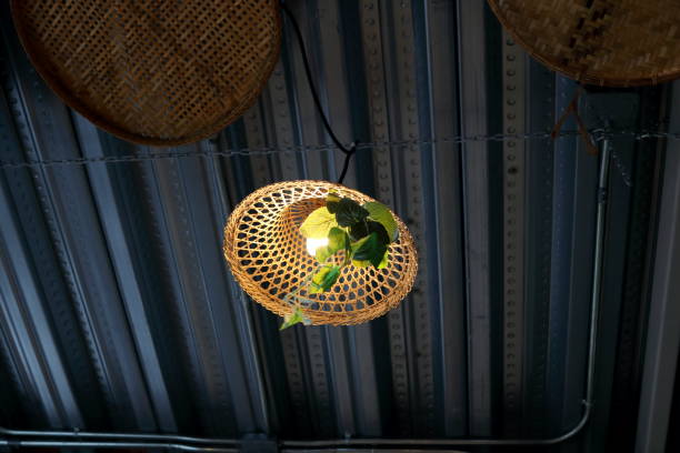 istock Bamboo weaving cover lamp and dark gray ceiling. 2034856585