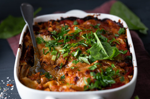 Classic italian lasagna with meat and vegetables served on table and ready to eat
