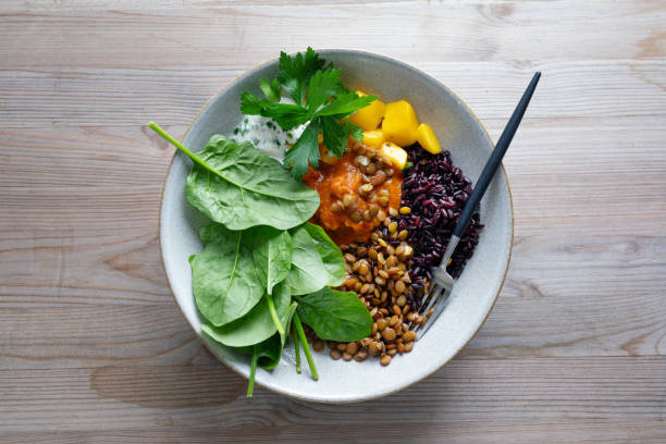 istock Exotic salad bowl with mango rice and nuts 2034857148