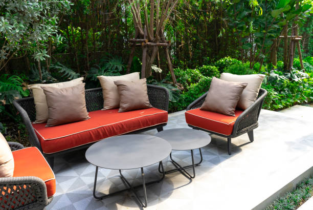 istock Backyard outdoor garden patio with modern wicker sofa and pillow. 2034873364